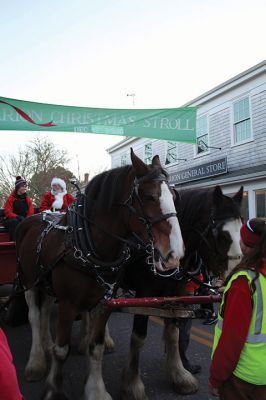 Marion Village Stroll
Cars lined several Marion streets as residents gathered for the town’s Christmas Stroll on December 12. Front Street and connecting village roads were partially closed for the event, as families enjoyed refreshments provided by area merchants at their doorsteps and along the roads. Clydesdale horses escorted Santa Claus and passengers, while the Sippican Elementary School Band played, Tabor Academy student singer Wesley Lai of Hong Kong sang, and a bike rider juggled bowling pins. Photos by Mick Colageo
