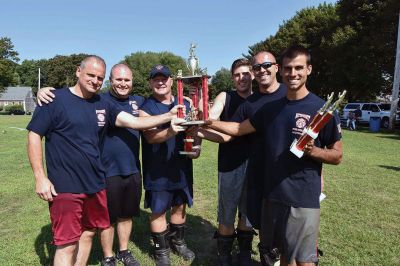 Mattapoisett Fire Department 
The Mattapoisett Fire Department team poses with the trophy they won for first place overall and several other trophies they won during the Fire Muster hosted by the Fairhaven Fire Department on Sunday, 8/28. Photo courtesy of Beth David.
