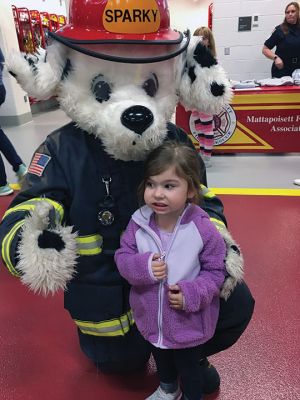 Mattapoisett Fire Department
Throngs of little children and parents enjoyed a fun evening on October 13, as the Mattapoisett Fire Department held its first Fire Prevention Month event in the new Fire Station on Route 6. Children enjoyed clamoring over and into several pieces of apparatus and taking pictures with Sparky the Fire Dog (aka Firefighter David Stewart.) Young and old alike learned at-home, fire-prevention techniques, including hands-on training for use of fire extinguishers. Select Board member Jodi Bauer said, “What little 

