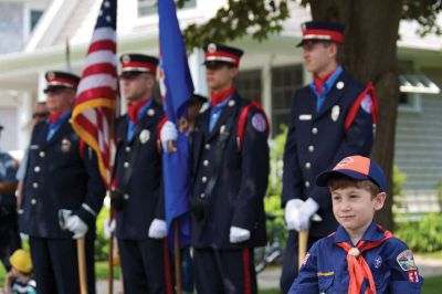 Mattapoisett’s Memorial Day
A cub scout from Troop 53 and the Mattapoisett Fire Department Honor Guard listen to the speakers during the town’s annual Memorial Day ceremony on May 28, 2012. Photo by Eric Tripoli.

