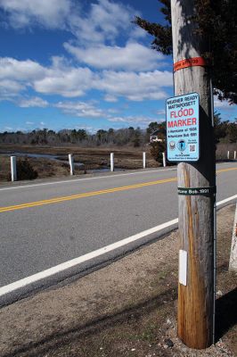 Hurricane Heights
Signs on a telephone poll alongside Mattapoisett Neck Road at the south end of the causeway at Molly’s Cove indicate flood levels that have resulted from historic storms. Looking north, one can see the marsh area that has become, along with the road itself, a topic of concern resulting in a study meant to address long-term access to and from the neck. Photo by Mick Colageo - April 1, 2021 edition
