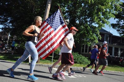 Race to the Finish 
July 4th morning in Mattapoisett means its time for the annual Mattapoisett July 4th Road Race, a five-miler that starts and finishes at Shipyard Park. The proceeds fund scholarships to ORR graduates. Photos by Sarah French Storer
