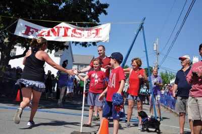 Race to the Finish 
July 4th morning in Mattapoisett means its time for the annual Mattapoisett July 4th Road Race, a five-miler that starts and finishes at Shipyard Park. The proceeds fund scholarships to ORR graduates. Photos by Sarah French Storer
