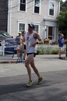 48th Annual Mattapoisett Road Race 
The 48th Annual Mattapoisett Road Race once again brought out young and old alike. Overcast skies were welcomed but the July 4th heat was tough for the runners and the cheering crowds who begged for shade. The field of runners was well over 1,000 and coming in first was Joe Farrand at 26:59. Shortly after, the first female to finish was Kim Bolick at 29:54. Before the starting gun sounded there was a moment of silence in honor of Maurice “Mudgie” Tavares who established the Mattapoisett Track Club, and the 
