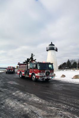 Santa Claus
Santa Claus and his elves swung by Ned’s Point, courtesy of the Mattapoisett Fire Department on Saturday morning. The Fire Department split up into Red and Green teams to cover neighbors in every corner of town as Santa waved to of families waiting along the roadside. Photos by Mick Colageo
