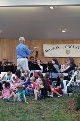 Young People’s Concert
The Marion Concert Band catered to the young ones on July 27 during its children’s-themed performance, “Young People’s Concert,” with selected songs familiar to children. Here, band conductor Tobias Monte sits onstage with the children, firing up their imaginations, and handing out instruments for the children to experiment with. Photos by Jean Perry
