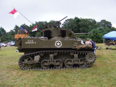 Rochester Country Fair
One of 26th Infantry Division Yankee Divisions World War II military vehicles that was on display at the Rochester Country Fair. The Infantry Division is a group of re-enactors that tours parades and fairs throughout the northeast. Above right: Young members of the 26th Infantry Division Yankee Division saluting a higher ranking official. Photos by Adam Silva.
