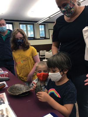 Mattapoisett Library
On August 7, the Mattapoisett Library hosted the New England Coastal Wildlife Alliance. Interns from the Wareham-based agency gave a hands-on talk to small children on local sea turtles. NECWA studies local marine life, collecting data for a variety of agencies. Some 60 kids from the Tri-Town area and beyond learned about turtle eating and nesting habits and made crafts depicting turtles. Photos by Marilou Newell
