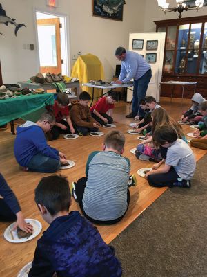 Marion Natural History Museum
Geologist and social worker James Pierson of Mattapoisett gave a hands-on presentation about minerals and fossils to youngsters on March 16 at the Marion Natural History Museum under the direction of Liz Leidhold. The afterschool program is one of several being offered by the museum, an institution now celebrating its 150th anniversary. To learn more about programs for the young and young at heart visit marionmuseum.org. Photos by Marilou Newell
