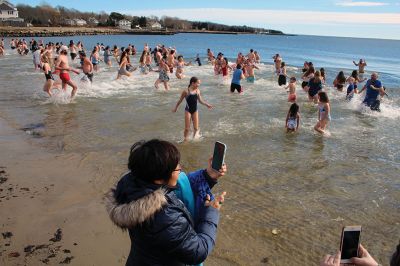 Mattapoisett Polar Plunge
New Year’s Day 2023 was bright and balmy when over 100 “plungers” ran, walked, hopped and slid into the freezing waters at Mattapoisett Town Beach. The event was hosted by an ad hoc group collecting donations for those battling cancer. The group has been successful in their efforts to help offset the unseen costs associated with a cancer diagnosis impacting local families. Heather Bichsel of the group said that this year they collected approximately $2,500, monies that will be given to a local family as wel
