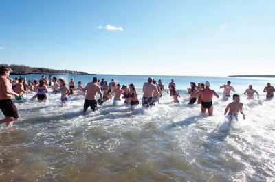 Freezin’ for a Reason Polar Plunge
It takes a certain type of person to jump into the cold ocean on New Year’s morning. Behold, the locals who fit that description as they enjoy a frosty January 1st at Mattapoisett Town Beach for the annual Freezin’ for a Reason Polar Plunge! Hundreds lined the beach to take the plunge, with bundled spectators watching from the sidelines and cheering as the plungers charged ahead screaming and shrieking with exhilaration. Proceeds from the plunge benefit locals battling cancer. Photos by Colin Veitch
