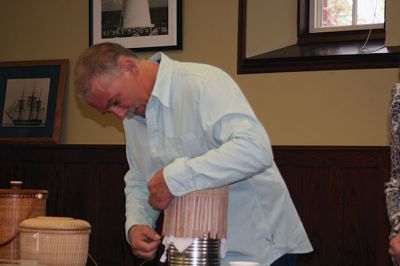 Nantucket Baskets
Melanie Dupuis and Rick Padelford demonstrated the art of Nantucket basket weaving at the Mattapoisett Free Public Library on May 6. Dupuis, a former cobbler, and Padelford are master basket weavers who have been studying and teaching the craft for many years. Dupuis said that the Nantucket baskets are known all over the world for their beauty and practicality. Photo by Marilou Newell
