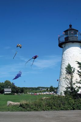 Ned's Point Wind
It's a bird, it's a plane, it's … Labor Day weekend at Ned’s Point in Mattapoisett, where the sky turned into a life-size aquarium. Visitors to the park on Saturday launched large and lively kites mimicking the movement of varying sea-life creatures. Held back by gusty breezes, the "fish" faced the lighthouse as if preparing for a feeding frenzy. Children ran in the grass, while many sat in lawn chairs along the perimeter and just took it all in. Photo by Mick Colageo
