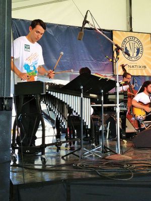 Maxx Wolski of Mattapoisett
ORRHS student Maxx Wolski of Mattapoisett soloing on the vibraphone while performing with the Massachusetts Music Educators Association All-State Jazz Band at the Newport Jazz Festival on Sunday, August 1.  
