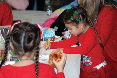 Pizza with Santa
The Marion Police Brotherhood held its annual Pizza with Santa at the Benjamin D. Cushing Community Center on Sunday, December 8. ‘Chief’ Santa and Mrs. Claus entertained the little ones before enjoying a pizza lunch. The Police Department’s “Fill a Cruiser” toy drive was in full gear as well, with several guests bringing toy donations to benefit children in foster care. Photos by Jean Perry
