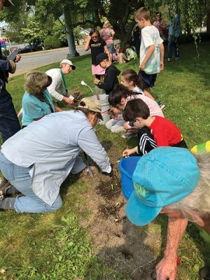 Dunseith Park
With a crew of eager third graders, Don Cuddy along with other members of the Mattapoisett Land Trust education committee planted sunflowers at Dunseith Park located at the corner of North Street and Route 6 recently. This is a continuation of a major goal by the land trust: educating children about our natural environment.
