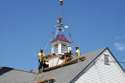 Plumb Library
A new cupola complete with a copper covered roof and refurbished bronze and copper eagle weathervane now graces the roof of the Plumb Library in Rochester center. Old Colony Regional Vocational Technical High School carpentry shop students in partnership with Diversified Roofing Systems, New Bedford, owned by Richard Miranda, built the new cupola for the town. Rochester’s facility manager Andrew Daniel spearheaded the project and brought together the school and business partners. Photo by Marilou Newell
