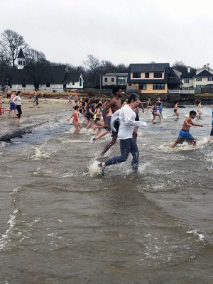 New Year Plunge
It was not publicized or heavily promoted, but traditions are hard to break. That was the case on New Year’s Day 2022 when a hearty group of some 200 “plungers” arrived at Mattapoisett Town Beach for their annual dip in the harbor. Last year the event was not publicized at all, said this year’s organizers, Heather and Michael Bichsel. “But we decided since people were going to show up anyway, we’d help to keep this going.” 
