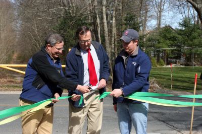 Rail Trail
Bill Straus, State Representative, Steve Kelleher, Chairman of Mattapoisett Rail Trail, and Jordan Collyer, Vice-Chairman of the Mattapoisett Board of Selectman (left to right) cut the ribbon to open the Inauguration of the Mattapoisett Rail Trails Old Colony Mile. Photo by Sarah K. Taylor. 
