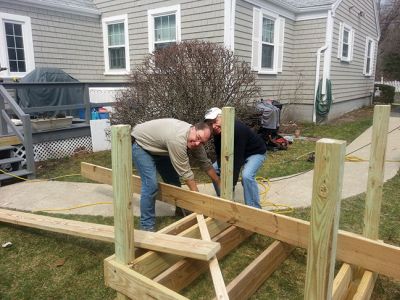 Ramp Construction
Andy Bobola of the Mattapoisett Building Department, Bruce Rocha Jr. of Fisher and Rocha and the Mattapoisett Lions Club recently collaborated on building this handicap ramp 
