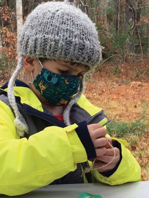 Rochester Land Trust
Wyatt Smith, age 5, made winter treats for woodland animals on December 18 and then enjoyed placing them along the Trail Tale path at the Rochester Land Trust Church Preserve property.Photos by Marilou Newell
