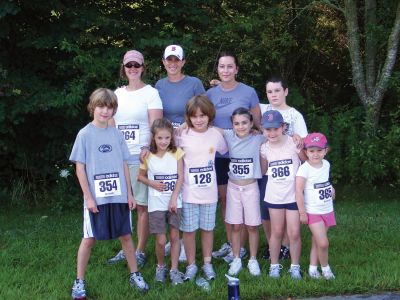 Rochester Runners
Rochester Road Race runners; front row: Jack Sollauer, Jennifer Williams, Meghan Pierce, Sarah Sollauer, Rachel Foye and Julia Foye, Back row: Jill Foye, Sandi Sollauer, Betsi Gingras and Cameron Pierce. With the exception of Ms. Gingras, this is everyones first time running in the fourth-annual Rochester Road Race, according to Ms. Sollauer. Photo by Adam Silva
