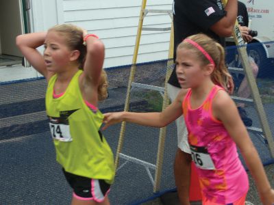 Rochester Road Race
12-year-old Kate Hughes, left, and her 10-year-old sister Meg, right, were the top finishers in the under 12 category with times of 20:18 and 20:19, respectively.  Photo by Katy Fitzpatrick. 
