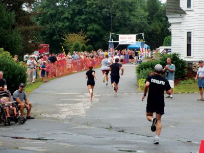 Rochester Road Race 
Runners cross the finish line on Saturday, August 11 at the 7th Annual Rochester Road Race sponsored by Covanta SEMASS.  The race kicked off on Dexter Avenue, winded its way through various streets in the town and finished right in front of Town Hall.  Photo by Katy Fitzpatrick. August 16, 2012 edition

