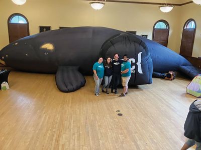 Right Whale
The ins-and-outs of a life-size right whale located in the Marion Music Hall were enjoyed by more than 70 children during the Natural History Museum’s block party held on June 24 in conjunction with the Elizabeth Taber Library. Photos courtesy Elizabeth Leidhold
