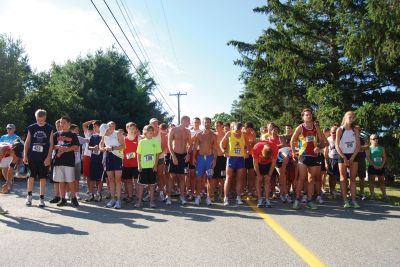 Rochester Road Race
Runners arrange themselves at the starting line of the August 14, 2010 Rochester Road Race. Proceeds from the Rochester Road Race went to benefit Damiens Pantry in Wareham. Photo courtesy of Chuck Kantner.
