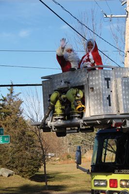 Mr. and Mrs. Santa Claus
Mr. and Mrs. Santa Claus make their turn through Rochester Village onto New Bedford Road on December 5. Transported by the Rochester Fire Department on a journey that began at Fire Station No. 3 at 200 Ryder Road and accompanied by Santa’s helpers riding along in trucks, Mr. and Mrs. Claus made their way down many Rochester roads, spending hours to visit hundreds of children waiting at the end of their driveways and on street corners. A Google map device tracked Santa’s whereabouts throughout the ride. Phot
