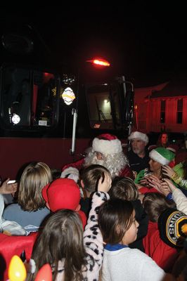 Rochester Christmas Tree
The town enjoyed a beautiful Monday evening and a large turnout, as children gathered on the steps of Town Hall to sing carols, and Santa Claus arrived with a Fire Department escort to hand out candy canes. Photos by Mick Colageo
