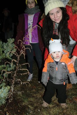 Rochester Christmas Tree
Checking out the freshly-lit Rochester Christmas tree is one-year-old Ethan Cooper Fortin. The town enjoyed a beautiful Monday evening and a large turnout, as children gathered on the steps of Town Hall to sing carols, and Santa Claus arrived with a Fire Department escort to hand out candy canes. Photos by Mick Colageo
