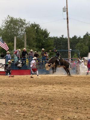 Rochester Rodeo
The second of the bi-weekly rodeo was held at the Rochester Fair Grounds this past Saturday by New England Rodeo. Present were over 20 professional bull riders from New England, Latin America, and Brazil. There were also professional barrel riders and mounted shooters. There were some young cowboys and cowgirls who also gave it their best to stay on a bucking pony. Children under 14 years of age were invited to the field to participate in competitive games to win a ribbon. Photos by Michael J. DeCicco & Hea
