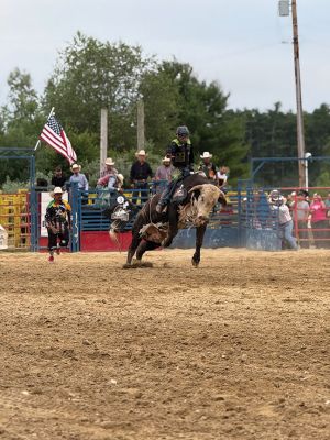 Rochester Rodeo
The second of the bi-weekly rodeo was held at the Rochester Fair Grounds this past Saturday by New England Rodeo. Present were over 20 professional bull riders from New England, Latin America, and Brazil. There were also professional barrel riders and mounted shooters. There were some young cowboys and cowgirls who also gave it their best to stay on a bucking pony. Children under 14 years of age were invited to the field to participate in competitive games to win a ribbon. Photos by Michael J. DeCicco & Hea
