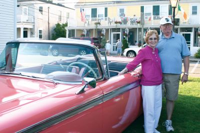 Car Show
Cindy Bristol, left, and Charles Rucker, right, pose in front of their 1959 Ford Galaxie. The car is Ford Geranium pink and has only been driven 70,000 miles in 50 years. The car is named for the star pattern that decorates the front grill. The Galaxie was one of many restored antique cars that filled Shipyard Park at the 2009 Mattapoisett Heritage Days car show. Photo by Anne O'Brien-Kakley
