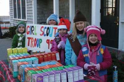 Holiday Cookies
Marion Girl Scout Troop 99 sold cookies outside in the bitter cold on December 12, 2009 on Front Street. The Sippican Womans Club held a house tour that included all the landmarks stops in the Village, including the Marion Art Center and the Sippican Historical Society. The girl scouts took advantage of a bustling village to raise some money, with occasional breaks for cocoa. Photo by Anne OBrien-Kakley.
