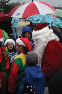 Santa's Arrival
Marion children gave a rock stars welcome to Santa Claus, who arrived at Marions Annual Holiday Stroll by boat on December 13. The pouring rain didnt stop Santa from spreading candy and holiday cheer to the crowd of exciting children. Clydesdale horses waited patiently to take visitors on a stroll through the village, and the town Christmas tree was lit at Bicentennial Park. Photo by Anne OBrien-Kakley.
