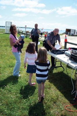 Safety Days
The Marion Police Brotherhood hosted their first annual Public Safety Day at Marion's Silvershell Beach on Saturday, June 13. The event included the installation of child safety seats in residents' vehicles, fingerprint and photo id cards for children along with displays from a variety of local, state and federal government public safety agencies. Photo by Robert Chiarito.
