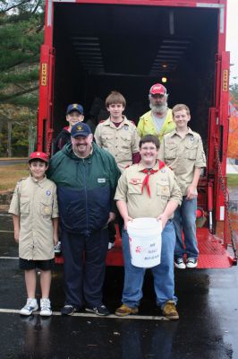 Electronics Recycling
Despite the rain, Boy Scout Troop #31 in Rochester held an Electronics Recycling Day at Plumb Corner on October 24. They loaded up a truck with old monitors, televisions, microwaves and assorted appliances for recycling. The troop also collected cell phones, bottles and cans. Photo by Anne O'Brien-Kakley.

