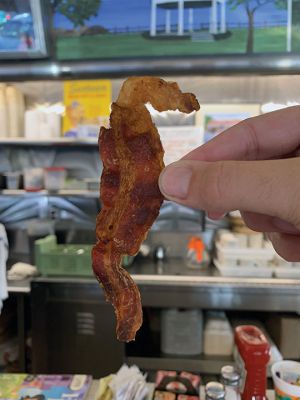 Appetizing Apparition
“Appetizing Apparition” – Six-year-old Nathan Grossman decided to behold his breakfast long enough to notice something different about this piece of bacon before taking a bite. “Hey, look! The bacon looks like the Seahorse!" Grossman shouted out, according to Liza Appleby of Mattapoisett who witnessed the excitement. “I surprisingly had to agree,” said Appleby. “It certainly did look like Salty the Mattapoisett Seahorse.” Photo courtesy Liza Appleby November 14, 2019
