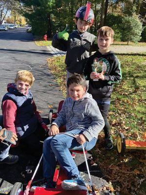 Soapbox Derby
Marion and Rochester Cub Scouts came together on November 6 for a soapbox derby on Holmes Street in Marion. The longtime fundraising event was not held in 2020 due to the coronavirus pandemic but made a roaring return on Saturday, as children raced their homemade go-carts and collected donations for the Murphy and Others, Living Interdependently for Future Endeavors, Inc. (M.O. L.I.F.E.) non-profit food pantry in Fairhaven. Photos by Mick Colageo and Reade Whinnem
