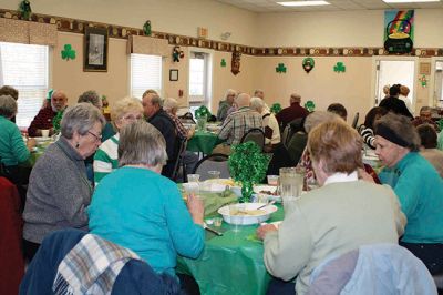 Rochester Council on Aging St. Patrick's Day Luncheon
The folks at the Rochester Council on Aging never miss a holiday or a chance to gather together to celebrate. On Friday, March 14, the COA hosted an Irish luncheon, complete with, of course, corned beef and cabbage to mark the occasion. Irish or not, most donned their St. Paddy’s green and  broke bread together with Selectman Naida Parker, who assisted in serving up lunch, along with COA Director Sharon Lally. At the COA, Irish eyes are always smiling… By Jean Perry
