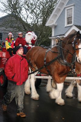 Strolling in Marion
Heavy rain stopped just in time for Santa Claus to make his first turn around Marion on a wagon pulled by Clydesdale horses during the towns December 12, 2010, Holiday Stroll event. Photo by Laura Pedulli.
