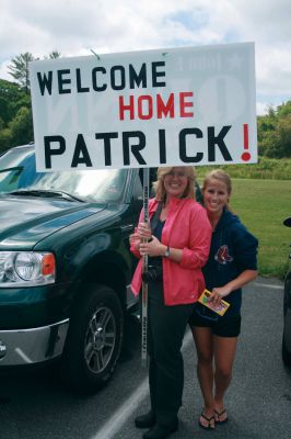Survival
Sue Seguin, left, and her daughter Katelyn Cummings, right, hold a sign as they await the return of Pat Cummings, 13, from the ORRJHS survival trip. Photo by Katy Fitzpatrick

