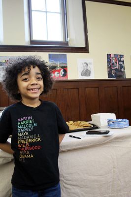 Creative Expression Contest
Owen Excellent, 6, stands before his favorite entry in the Grades 7-12 Creative Expression Contest held by Tri-Town Against Racism. Owen and his father John were among the judges for the contest with the theme “African Americans in the Arts.” Three winners were announced on Saturday during a gathering at Mattapoisett Library. Photo by Mick Colageo
