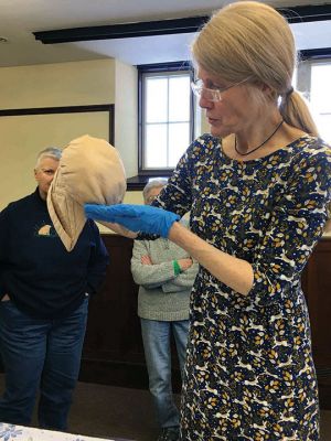 Textile Conservation
Kathryn Tarleton gave a presentation on the art and science of textile conservation on March 18 at the Mattapoisett Free Public Library. She also examined historic articles for several area residents. Photos by Marilou Newell
