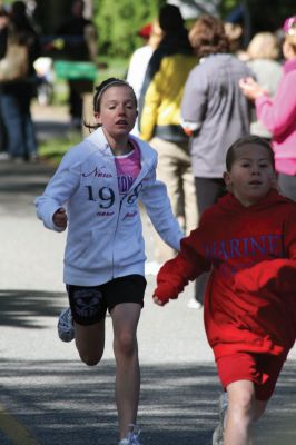 Mom's Running
Over 600 runners came to Mattapoisett on May 9, 2010 to celebrate mom in the fourth annual Tiara Classic 5K road race. This years race had more runners than ever, despite the wind and cold temperatures. The road race benefits the New Bedford Womens Fund, an organization that empowers and provides upward mobility to women. Photos by Anne OBrien-Kakley.
