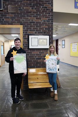 Tree City USA Poster Contest
Emma Lowe, right, is recognized alongside runner-up Dominic Philie for finishing first and second, respectively, out of a record 43 entries in Old Hammondtown School’s Grade 5 Tree City USA poster contest in Mattapoisett. “I thought of a different idea, but I liked this one the best,” said the 11-year-old Lowe, who will go on to compete in statewide competition. Philie, 10, got noticed for his creative approach, putting the clock in the background of his poster. In a new wrinkle this year, participating stu
