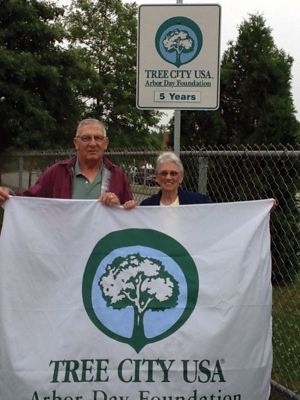 Tree City USA
Mattapoisett was recognized as a five-year recipient of the Tree City USA Award at a recent Massachusetts Department of Conservation and Recreation (DCR) Urban and Community Program. Mattapoisett Tree Warden Roland Cote is shown with Tree Committee member Ann Briggs with the new five-year sign. Tree City USA is sponsored by the Arbor Day Foundation and works with the DCR in Massachusetts to assist communities in protecting, growing, and managing community trees and forests. Photo courtesy of Sandra Hering. 

